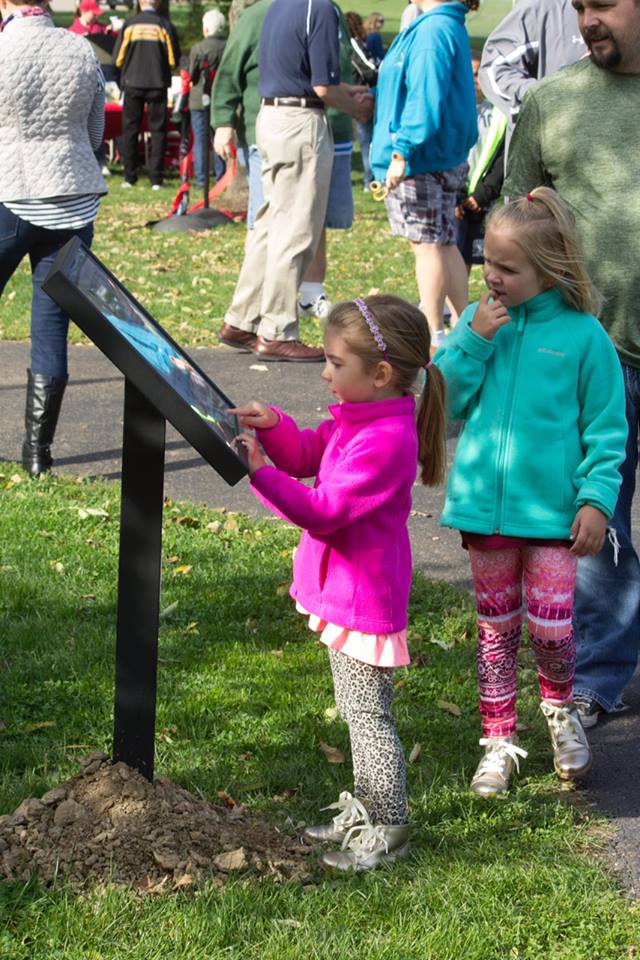 girls reading the storywalk(r) at Dover City Park