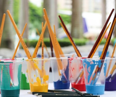 Paint in cups with brushes